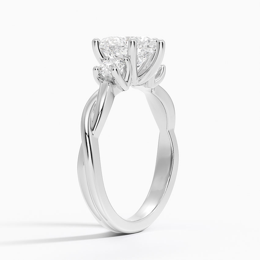 Side angle showing the twisted infinity shank and three-stone setting