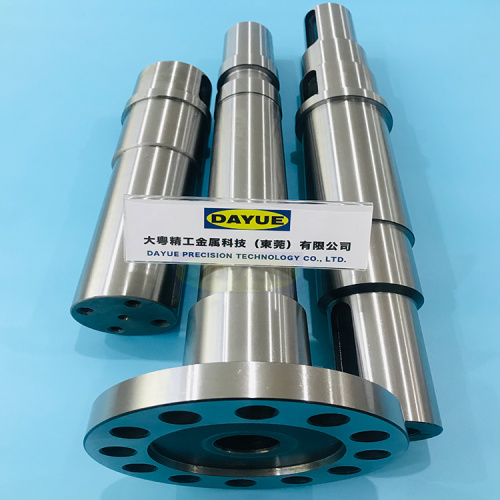 Grinding and machining hardened steel shaft components