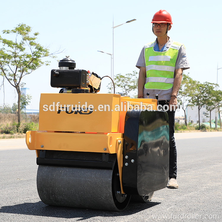 Walking behind double drum vibratory roller compactor