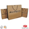 Flat handle brown twist kraft paper bag