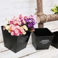 Square black flower arrangement bucket