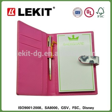 Notepad with leather jacket and pen attached