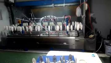 Macchina automatica per verniciatura a spruzzo con essiccazione UV