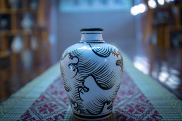 Under glaze painted wave bottle