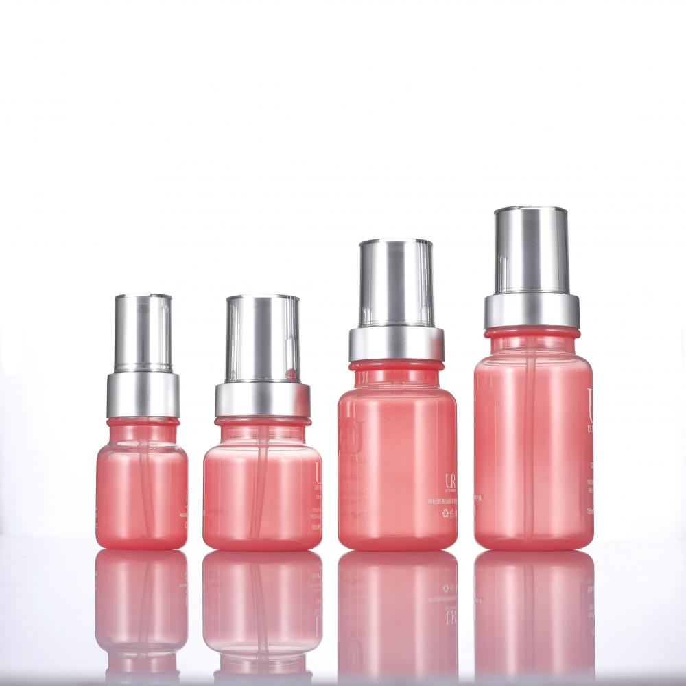 Aangepaste plastic roze pompfles cosmetische verpakking