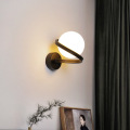 Spiral metal arm wall lamp opal glass shade