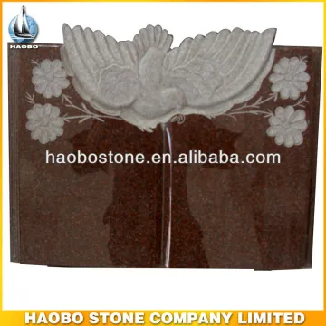 Book monuments with carvings in red granite