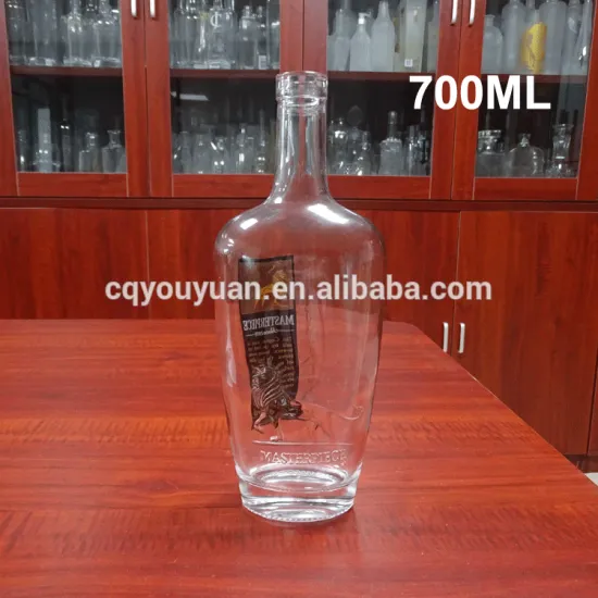 custom embossed 700ml empty clear spirit glass bottle wholesale