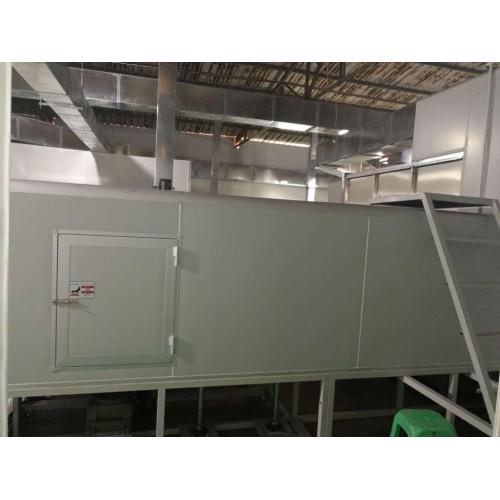 Industrial spray machine with UV dryer