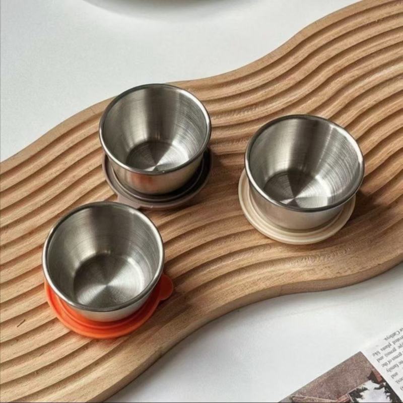 Elegant Metal Cups and Bowls with Smooth Arc Design