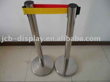 polished stainless steel post with red belt retractable barrier