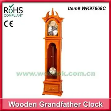 Woodpecker wooden old fashioned clock on floor