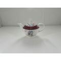 pink ceramic kettle with lid