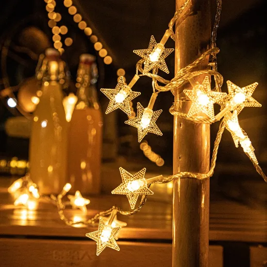 Outdoor Christmas Decor: 350 LED Star String Lights as a Waterfall Tree Topper for Garden and Yard Lighting