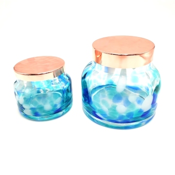 Swirled spots glass candle holder with metal lid