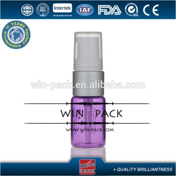 purple glass bottle with treatment pump