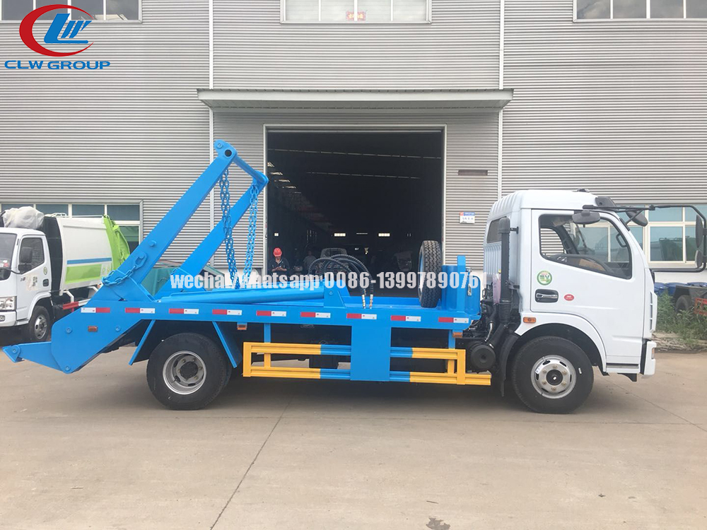 Swing arm garbage truck