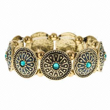 Floral Patterned Casting Stretch Bracelet in Burnished Gold Plating and Blue Zircon Rhinestones
