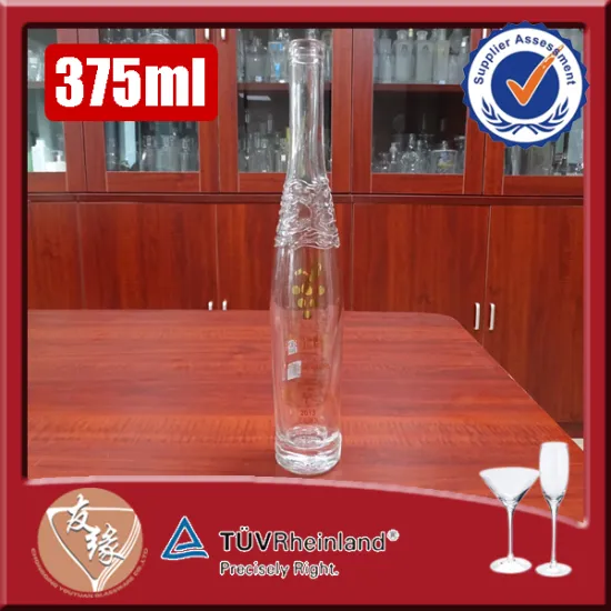 Beautiful embossing golden logo high white glass cork top spirit glass bottles in size 375ml