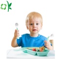Colher de silicone macia para refeições de bebês
