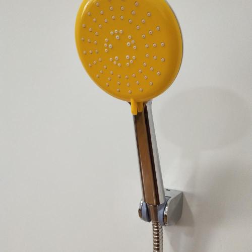 Yellow ABS plastic round handheld shower head