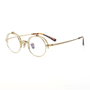 Goldene runde Titan -Designerbrille