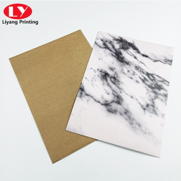 folder with marble pattern and botton string