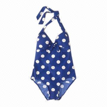 Children's swimwear with full white dots print and match binding, made of 80% nylon 20% spandex