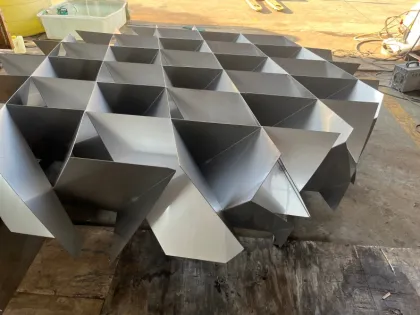 Corrugated plates gas-liquid mixer