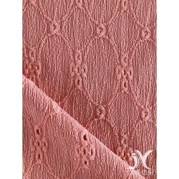 Tessuto jacquard in crepe con fiori a catena