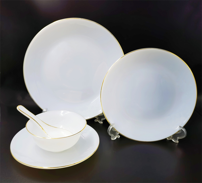 white plate with gold rim