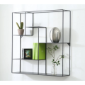 Metal wall-mounted shelf for interior decoration