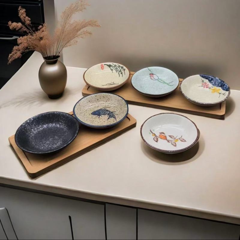Classic Asian Bowls and Plates with Fish and Flower Motifs