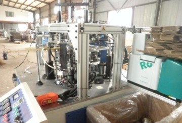 Paper lid forming machine