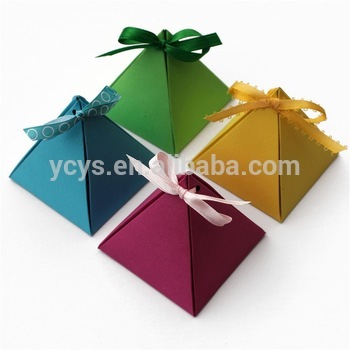 Christmas paper pyramid gift box, candy box with decorative ribbon