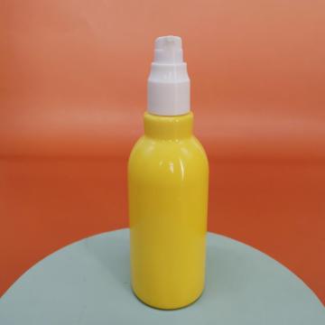 Flacon en verre de lotion jaune avec pompe