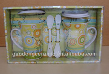 ceramic mug with lid and spoon