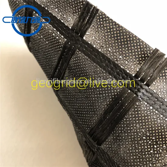 Polyester geogrid composite with geotextile