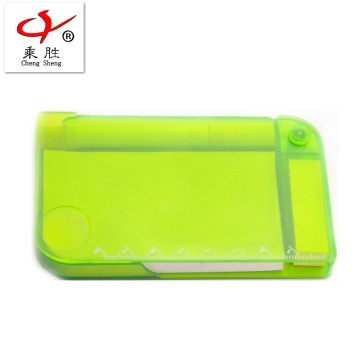 Small notepad with pen and mini plastic box