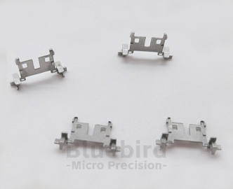 Cutting and forming of MIM structural parts