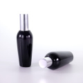 Special-shaped black glass bottle with silver cap