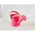 Pink metal kids watering can