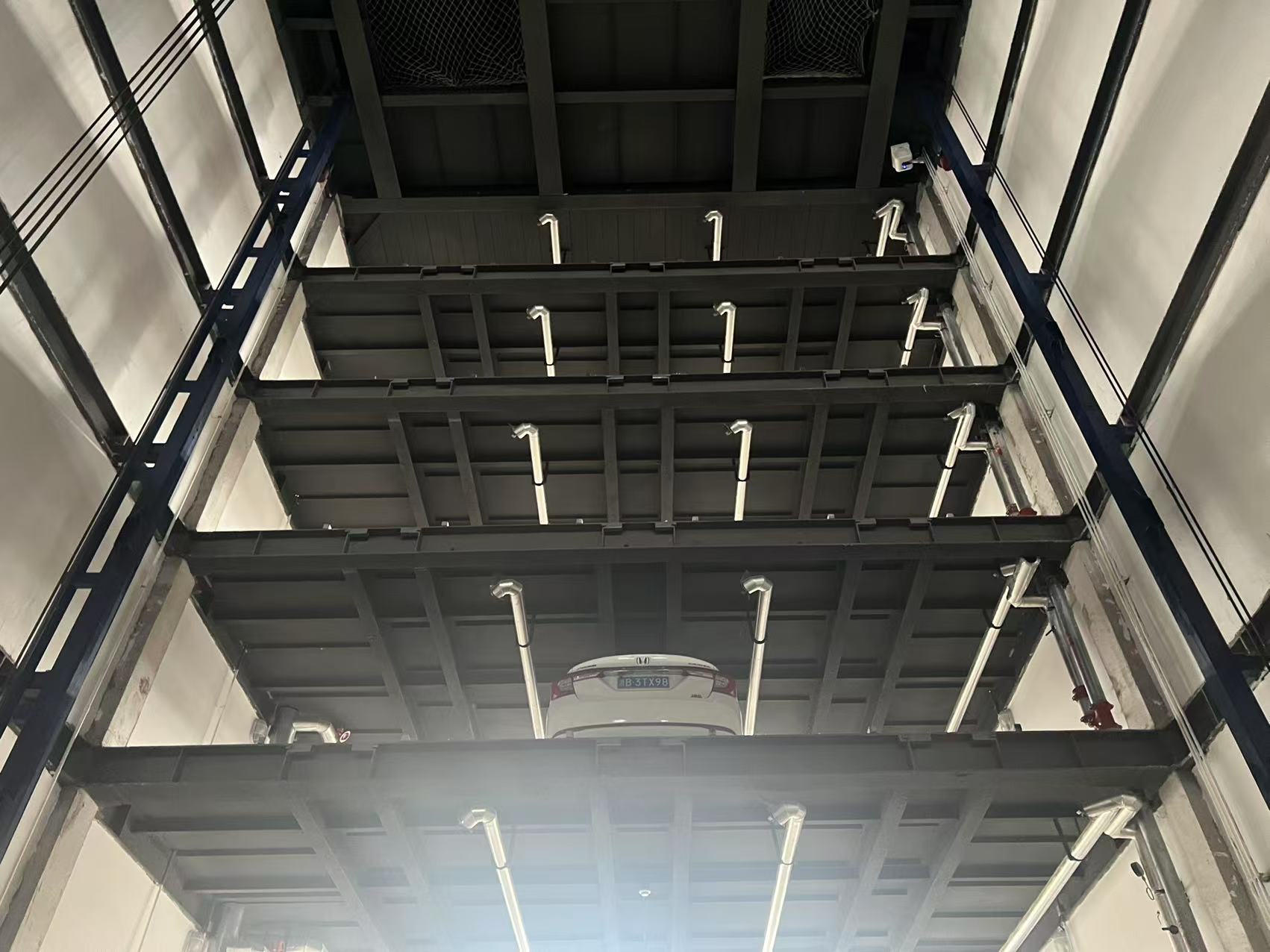 Vertical lifting parking system- Metro Trans