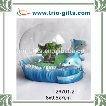 polyresin dolphin with glass sand globe