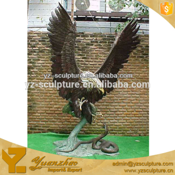 bronze garden statues of eagle catching the snake for sale