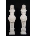 Classic Marble Statues Featuring Female Figures and Flowers
