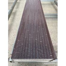 Reddish-Brown Metal Carved Plate With Water Patterns Covering Brick Patterns