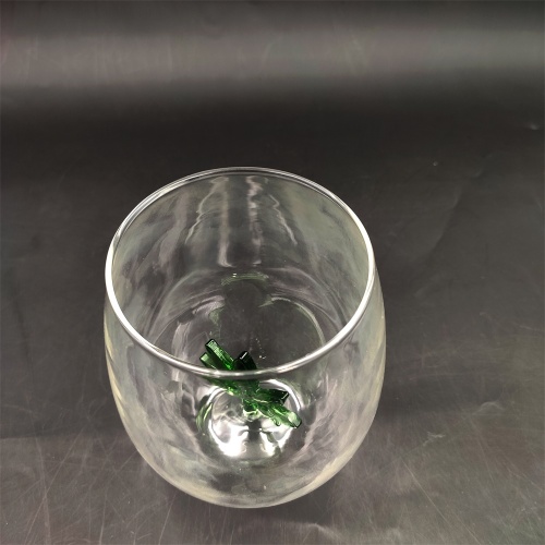 Heat resistant wine glass with green tree inside