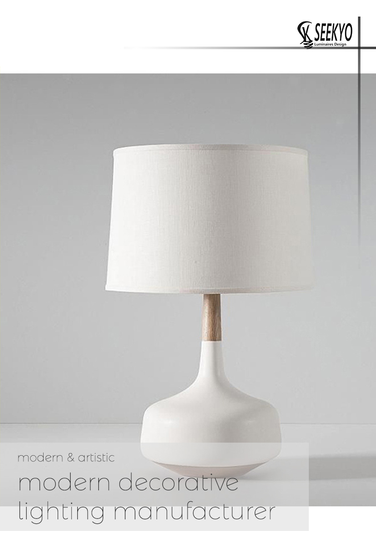 white resin table lamp with a fabric shade is a beautiful and elegant wood decoration for any room