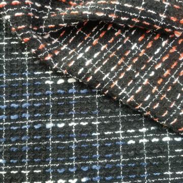 Wollboucle mit farbigen Slubgarnstoffen